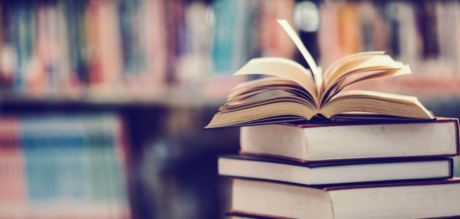 Book in library with open textbook,education learning concept