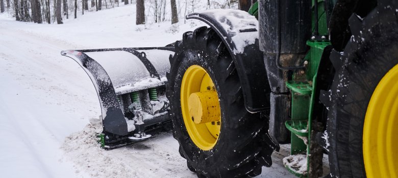 Cleaning machine is removing snow from road Cleaning machine is removing snow from road