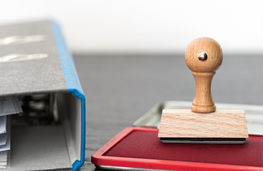 Stempel - rotes Stempelkissen - Aktenordner